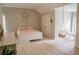 Bedroom has a hanging chair, rug, natural light, and neutral color palette at 4569 Campenille Trce, Suwanee, GA 30024