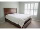 Bedroom has a queen size bed and window with shutters at 4569 Campenille Trce, Suwanee, GA 30024