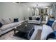 Spacious living room with elegant furniture and an open floor plan at 4569 Campenille Trce, Suwanee, GA 30024