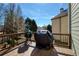 Outdoor deck area with cooking appliances and a covered grill, perfect for entertaining at 5046 Sara Creek Way, Sugar Hill, GA 30518