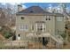 Expansive two-story home featuring a large deck, multiple windows, and exterior access door at 582 Braidwood Nw Dr, Acworth, GA 30101