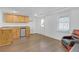 Basement with a kitchenette, wood-look floors and a gaming chair at 582 Braidwood Nw Dr, Acworth, GA 30101