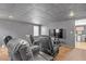 Basement movie area with home theater and large TV screen at 582 Braidwood Nw Dr, Acworth, GA 30101