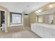 Bright bathroom featuring a soaking tub, shower, and spacious vanity with ample storage at 582 Braidwood Nw Dr, Acworth, GA 30101