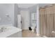 Serene bathroom featuring a vanity, toilet, and a shower with a patterned curtain at 582 Braidwood Nw Dr, Acworth, GA 30101