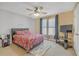 Cozy bedroom with a ceiling fan, windows with curtains, and a comfortable bed at 582 Braidwood Nw Dr, Acworth, GA 30101