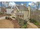 Charming two-story home featuring a stone facade, covered front porch, and well-manicured landscaping at 582 Braidwood Nw Dr, Acworth, GA 30101