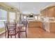 Bright kitchen space with stainless steel appliances, and a breakfast area overlooking a view at 582 Braidwood Nw Dr, Acworth, GA 30101
