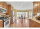 Sunny kitchen featuring stainless steel appliances and a cozy breakfast nook with large windows at 582 Braidwood Nw Dr, Acworth, GA 30101