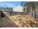 Spacious backyard with partial grass and a tall wooden fence, providing privacy and a serene outdoor space at , Fairburn, GA 30213