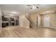 Open-concept living space with stylish wood floors, connecting the living area to the kitchen. Features a staircase and large window at , Fairburn, GA 30213