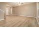 A bright and airy living room with wood floors, high ceilings, and white trim. A ceiling fan and large window add to the ambiance at , Fairburn, GA 30213