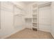 Walk-in closet with built-in shelving and carpeted floor at , Fairburn, GA 30213