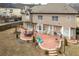 Aerial view of backyard featuring a patio, grill, and a lush lawn, perfect for outdoor living and entertaining at 1219 Hadaway Ct, Lawrenceville, GA 30043