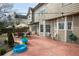 Backyard featuring a patio with outdoor seating and lush green lawn at 1219 Hadaway Ct, Lawrenceville, GA 30043