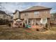 Spacious backyard featuring a patio with outdoor seating and lush green lawn at 1219 Hadaway Ct, Lawrenceville, GA 30043
