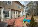Expansive backyard with a brick patio, mature landscaping, and room for outdoor entertaining and recreation at 1219 Hadaway Ct, Lawrenceville, GA 30043