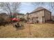 Expansive backyard with patio, seating, mature trees, and a well-maintained lawn at 1219 Hadaway Ct, Lawrenceville, GA 30043