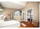 Bright bathroom with a soaking tub, glass-enclosed shower, and access to the main bedroom at 1219 Hadaway Ct, Lawrenceville, GA 30043