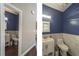 A well-appointed half bathroom featuring a stylish vanity and modern fixtures at 1219 Hadaway Ct, Lawrenceville, GA 30043