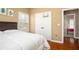 Bedroom with a double bed, hardwood floors, and view to another room at 1219 Hadaway Ct, Lawrenceville, GA 30043