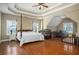 Spacious primary bedroom features a tray ceiling, sitting area, and ample natural light at 1219 Hadaway Ct, Lawrenceville, GA 30043