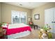 Bedroom with soft carpet and a window overlooking the yard at 1219 Hadaway Ct, Lawrenceville, GA 30043