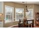 Bright breakfast nook area with a view to the backyard and pool at 1219 Hadaway Ct, Lawrenceville, GA 30043