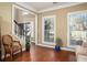 Bright entryway with large windows, a staircase, and neutral decor with attractive chair at 1219 Hadaway Ct, Lawrenceville, GA 30043