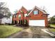 Charming two-story brick home with attached two-car garage and manicured front yard at 1219 Hadaway Ct, Lawrenceville, GA 30043