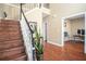 Spacious foyer with hardwood flooring, staircase, and neutral paint, showcasing an open floor plan at 1219 Hadaway Ct, Lawrenceville, GA 30043