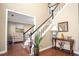 Welcoming foyer features hardwood floors, elegant staircase, and seamless flow into the adjacent living area at 1219 Hadaway Ct, Lawrenceville, GA 30043