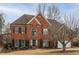 Beautiful two-story brick home with a well-manicured front lawn and a two-car garage at 1219 Hadaway Ct, Lawrenceville, GA 30043