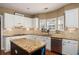 This kitchen has stainless steel appliances, beautiful countertops, and a convenient center island at 1219 Hadaway Ct, Lawrenceville, GA 30043