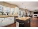 Bright kitchen features stainless steel appliances, granite countertops, and a center island at 1219 Hadaway Ct, Lawrenceville, GA 30043