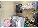 Organized laundry room with washer, dryer, storage shelves, and space for laundry essentials at 1219 Hadaway Ct, Lawrenceville, GA 30043