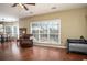 Bright living room with large window, wood floors, and comfortable seating area at 1219 Hadaway Ct, Lawrenceville, GA 30043