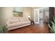 Cozy living room featuring a comfortable couch, stylish decor, and elegant French doors at 1219 Hadaway Ct, Lawrenceville, GA 30043