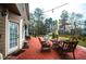 Enjoy the patio with red pavers, wooden furniture, and a string of lights for evening relaxation at 1219 Hadaway Ct, Lawrenceville, GA 30043