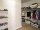 Walk-in closet with ample shelving, hanging space, and organized storage solutions at 1219 Hadaway Ct, Lawrenceville, GA 30043