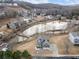 Beautiful aerial view of a home overlooking a pond and surrounding community at 15 Lakeside Way, Cartersville, GA 30121