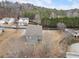 Aerial view of the home showing the backyard, which features a well-maintained lawn, a deck, and a patio at 15 Lakeside Way, Cartersville, GA 30121