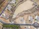 Aerial view of a neighborhood, showcasing homes around a pond, with mature trees and landscaping at 15 Lakeside Way, Cartersville, GA 30121