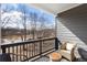 Relaxing balcony with seating and a scenic view of a lake and trees at 15 Lakeside Way, Cartersville, GA 30121
