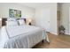 Neutral bedroom featuring a Queen bed, wood floors, and white trim at 15 Lakeside Way, Cartersville, GA 30121