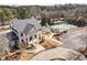 Aerial view of the clubhouse exterior, showing tennis court, and manicured grounds at 15 Lakeside Way, Cartersville, GA 30121