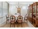 Formal dining room with hardwood floors, a china cabinet, and a table set for a sophisticated meal at 15 Lakeside Way, Cartersville, GA 30121