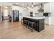 Spacious kitchen with stainless steel refrigerator, large island, and hardwood flooring at 15 Lakeside Way, Cartersville, GA 30121