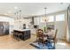 Bright kitchen with stainless steel appliances, a kitchen island with seating, and an adjacent dining area at 15 Lakeside Way, Cartersville, GA 30121