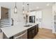 Contemporary kitchen with a large island, stainless steel appliances, and direct access to the staircase at 15 Lakeside Way, Cartersville, GA 30121